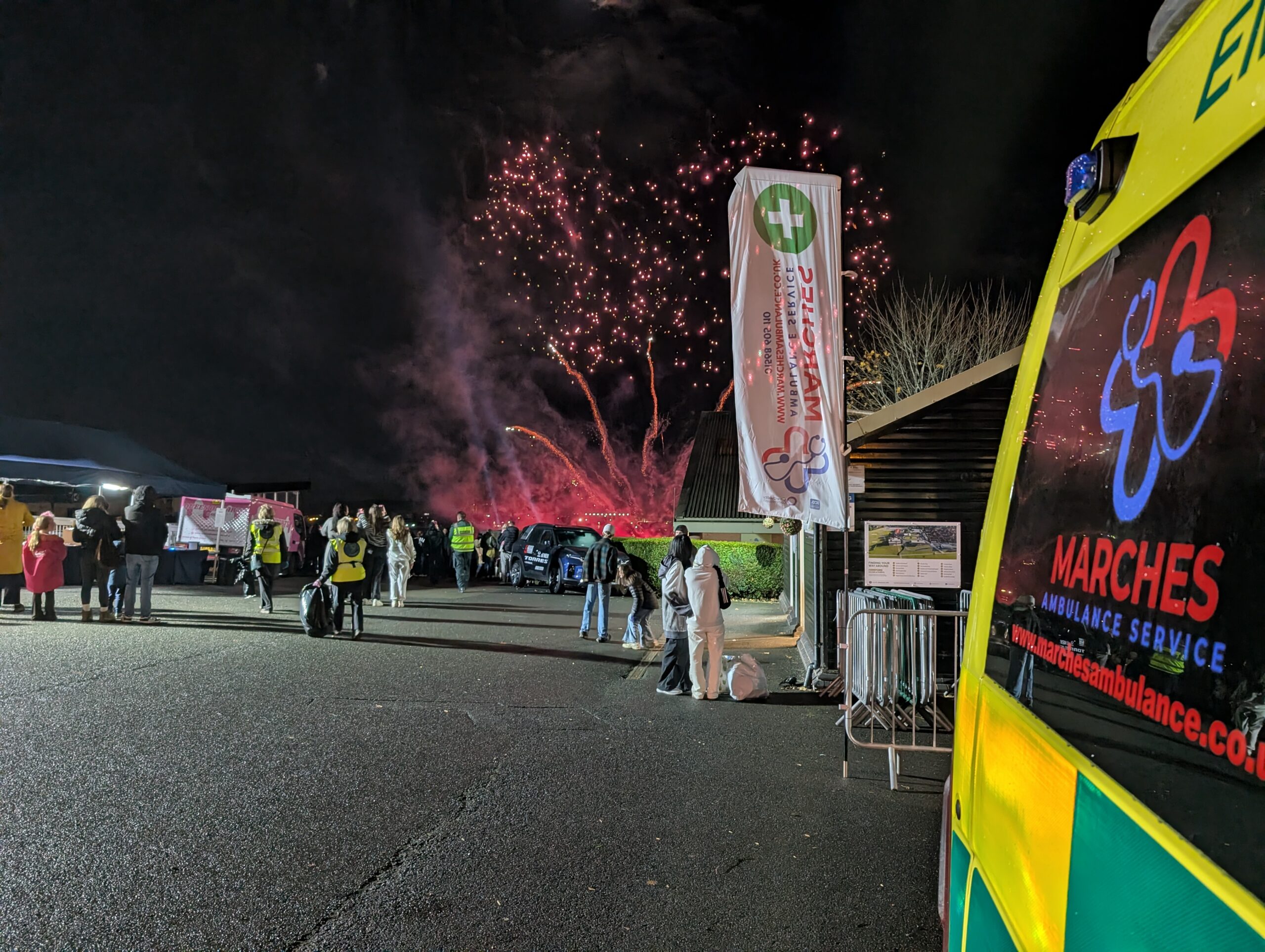 PXL_20251101_194830642.MP Marches Ambulance vehicle providing event medical cover at a fireworks display